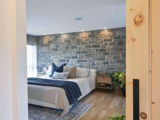 Experience rustic charm and modern comfort in this beautifully appointed bedroom.