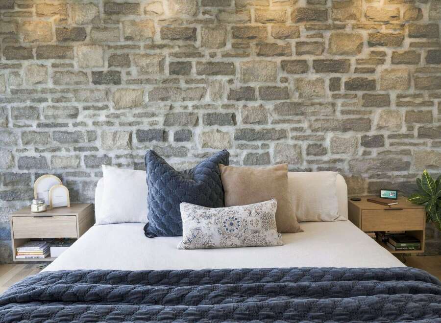 Experience rustic charm and modern comfort in this beautifully appointed bedroom.