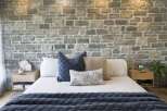 Experience rustic charm and modern comfort in this beautifully appointed bedroom.