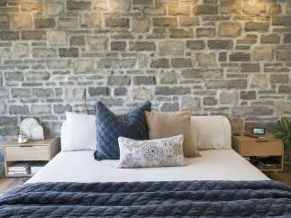 Experience rustic charm and modern comfort in this beautifully appointed bedroom.
