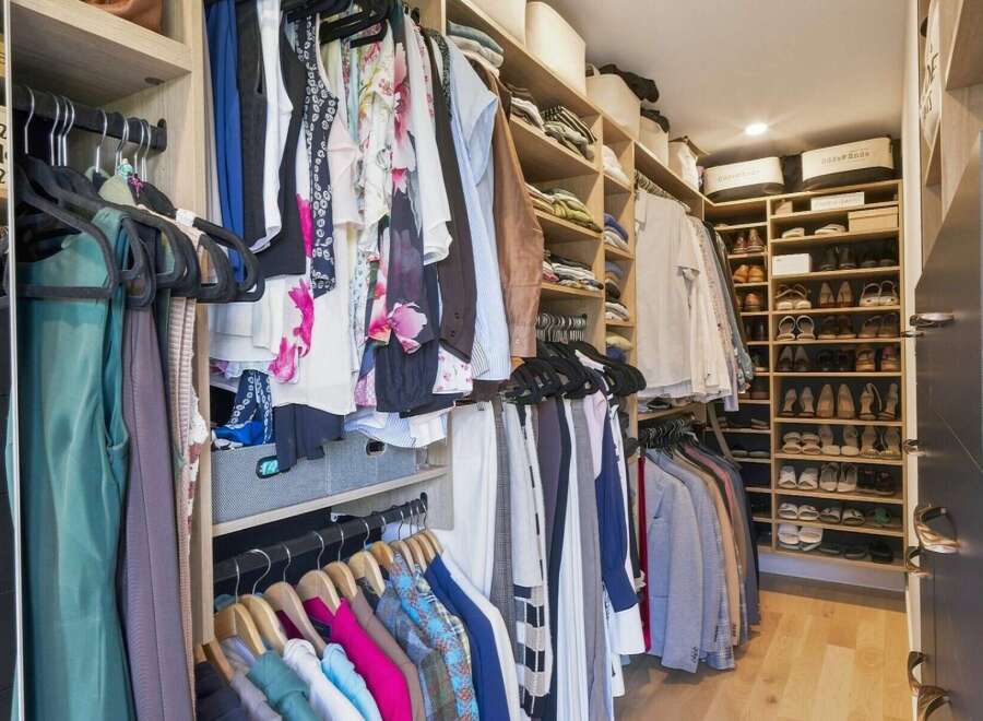 Step into this impeccably organized walk-in closet, designed for the discerning homeowner.