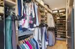 Step into this impeccably organized walk-in closet, designed for the discerning homeowner.