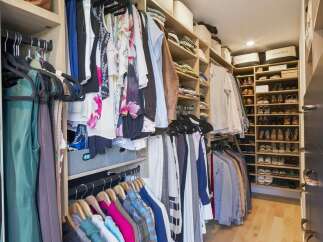 Step into this impeccably organized walk-in closet, designed for the discerning homeowner.
