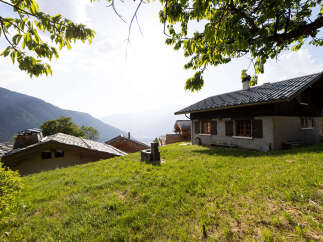 Nestled in a picturesque mountain landscape, this charming property offers a serene retreat with breathtaking valley views.