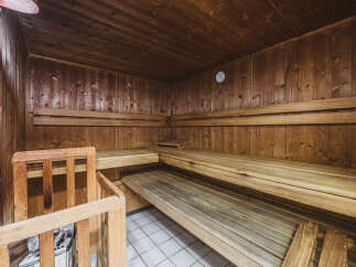 Experience ultimate relaxation in this beautifully crafted wooden sauna.