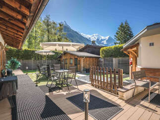 Experience breathtaking mountain views from this charming property's outdoor oasis.