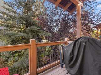Enjoy outdoor living on this spacious deck, perfect for entertaining or relaxing.