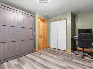 This versatile room features a space-saving murphy bed, perfect for maximizing living area.