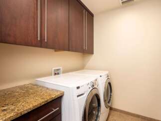 This laundry room features a convenient stackable washer and dryer set, perfect for maximizing space.