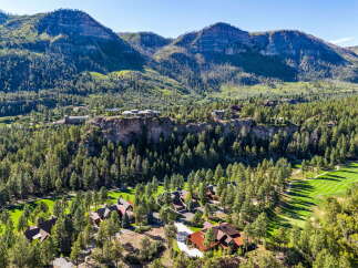 Nestled amidst a breathtaking mountain landscape, this property offers an unparalleled living experience.