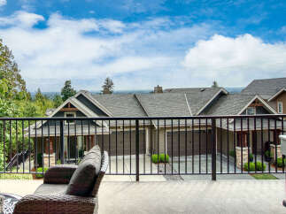 Enjoy breathtaking views from this stunning property, featuring a spacious deck perfect for entertaining.