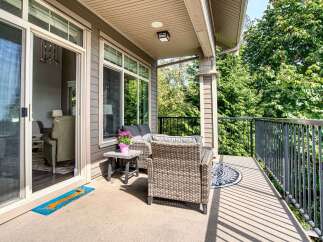 Enjoy outdoor living on this spacious balcony, perfect for relaxing or entertaining.