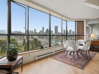 Experience breathtaking panoramic views of the city skyline and marina from this stunning dining area.
