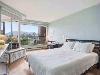 Experience breathtaking city and mountain views from this serene bedroom.