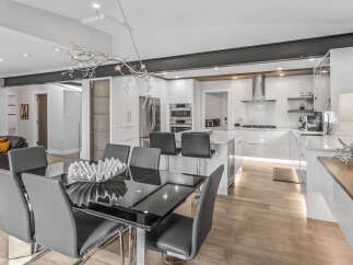 Experience modern luxury in this stunning open-concept kitchen and dining area.