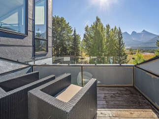 Enjoy breathtaking mountain views from this modern balcony, perfect for relaxing or entertaining.