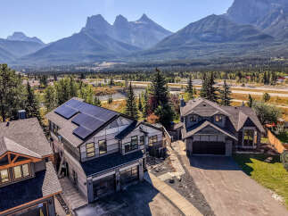Experience modern living in this stunning mountain-view home featuring sleek architecture and energy-efficient solar panels.