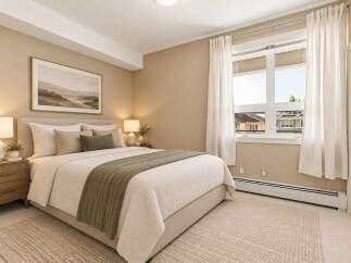 Experience comfort and style in this beautifully appointed bedroom, featuring a plush king-sized bed adorned with soft linens and decorative pillows.