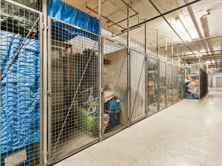 Secure your belongings in these spacious, caged storage units, perfect for residents needing extra space.