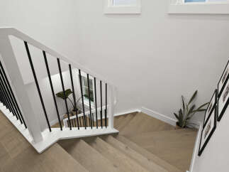 Ascend to the upper level via a beautifully designed staircase featuring a modern white railing with sleek black balusters.