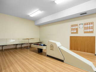 Enjoy endless fun in this home's private bowling alley, complete with a ball return and seating area.
