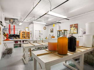 Discover a dedicated space for your brewing or winemaking endeavors in this well-equipped room.