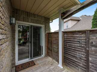 Enjoy outdoor living on this charming deck, perfect for relaxing or entertaining.