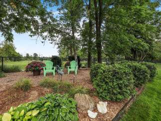Enjoy your morning coffee or evening relaxation in this charming backyard oasis.