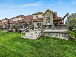 Enjoy outdoor living with this expansive multi-level deck, perfect for entertaining or relaxing.