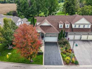 Discover this stunning property featuring a beautifully landscaped yard with vibrant fall foliage, perfect for enjoying the changing seasons.