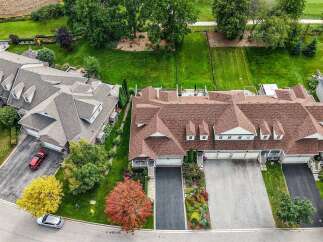 Experience luxury living in this stunning aerial view of a well-maintained suburban neighborhood.
