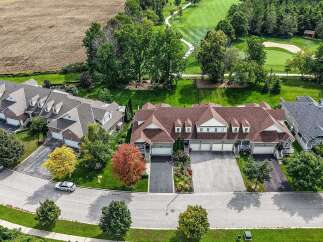 Discover modern townhome living adjacent to a pristine golf course.