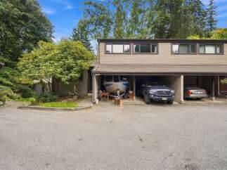 Discover comfortable living in this charming townhouse featuring a spacious covered carport perfect for your vehicles or boat storage.