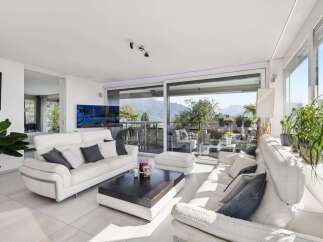 Experience luxurious living in this modern apartment with stunning mountain views.
