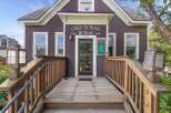 Step into the historic charm of the Old Tonini House, a beautifully preserved property offering a unique blend of vintage character and modern potential.