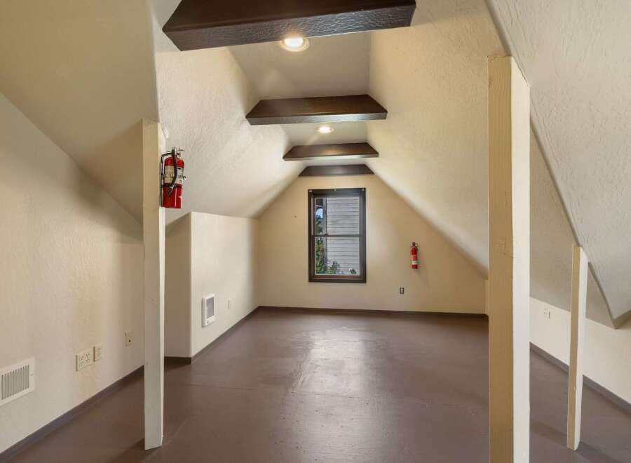 Discover this unique attic space, perfect for storage or a creative studio.