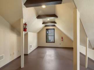 Discover this unique attic space, perfect for storage or a creative studio.
