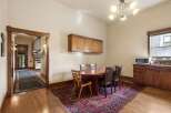 Step into this charming dining area, featuring a beautiful oval wood table surrounded by four elegant chairs, perfect for intimate gatherings.