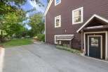Discover this charming property featuring a well-maintained exterior with rich brown siding and classic white trim.