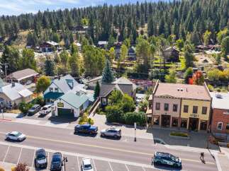 Discover this charming commercial property nestled in a picturesque mountain town, perfect for a business seeking a vibrant location.