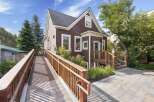 Discover the charm of Old Tonini House, a beautifully maintained property featuring a welcoming wooden ramp and accessible entrance.