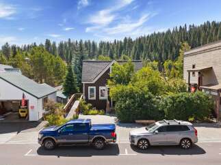 Discover this charming property nestled amidst a lush forest backdrop, offering a unique blend of residential and commercial potential.