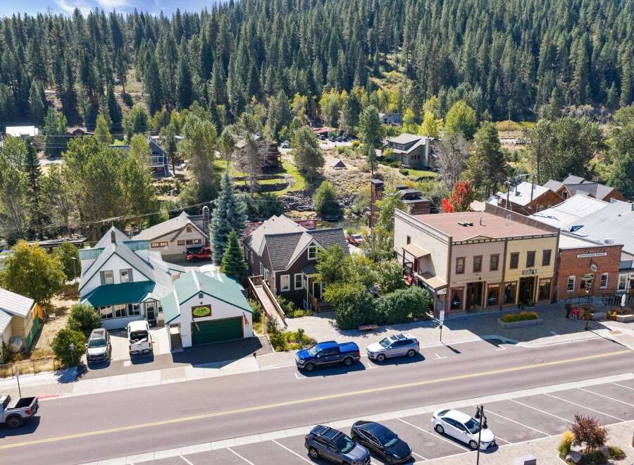 Discover this charming property nestled in a picturesque mountain town, offering a unique blend of residential comfort and commercial potential.