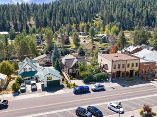 Discover this charming property nestled in a picturesque mountain town, offering a unique blend of residential comfort and commercial potential.