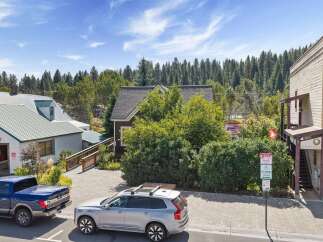Discover this charming property nestled amidst lush greenery and mature trees, offering a serene retreat.