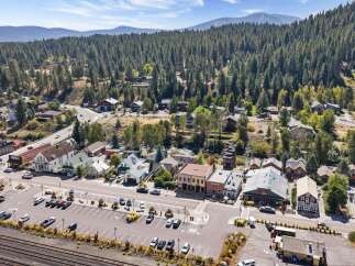 Discover this charming mountain town commercial property, ideally situated in a bustling downtown area with ample parking and high visibility.