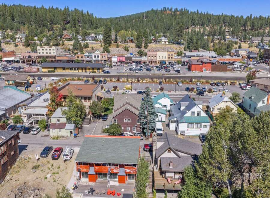 Discover this charming property nestled in a vibrant mountain town, offering a unique blend of residential living and commercial potential.