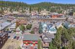Discover this charming property nestled in a vibrant mountain town, offering a unique blend of residential living and commercial potential.