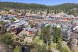 Discover this charming property nestled beside a serene river, offering breathtaking mountain and town views.