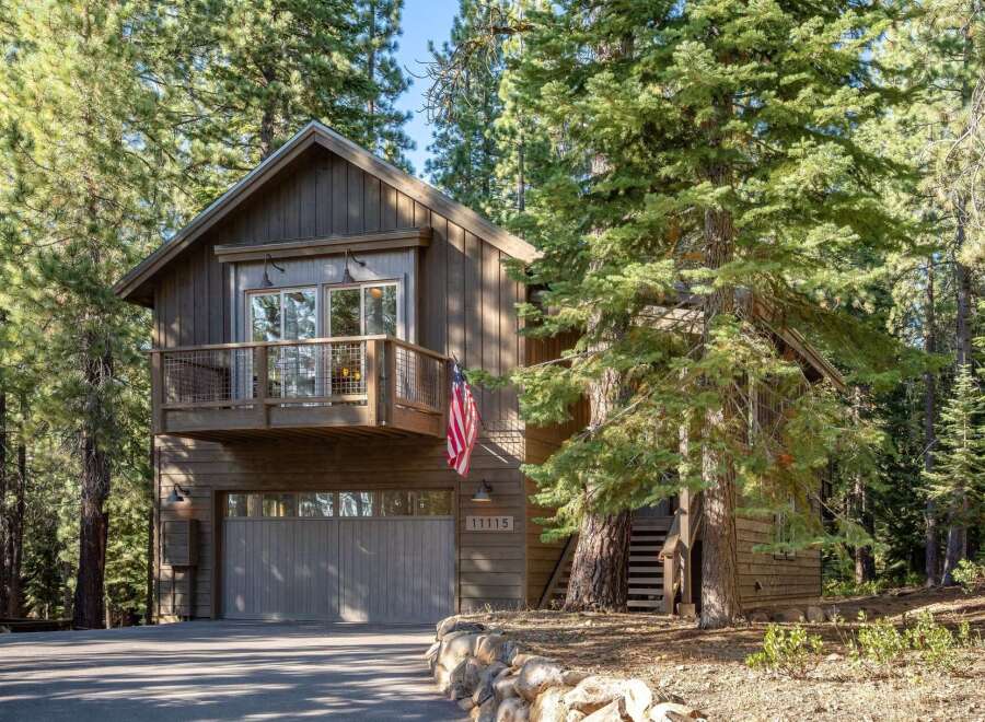 Nestled amidst towering pine trees, this charming mountain home offers a serene escape.